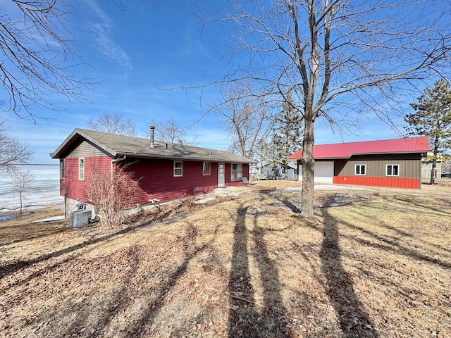 28887 Hi Vista Dr, Otter Tail Twp, MN 56515 - view of property exterior with central AC and an outdoor structure