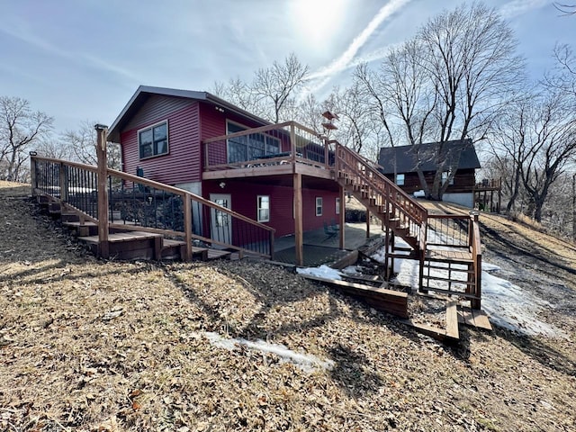 28887 Hi Vista Dr, Otter Tail Twp, MN 56515 - back of property with stairway and a wooden deck