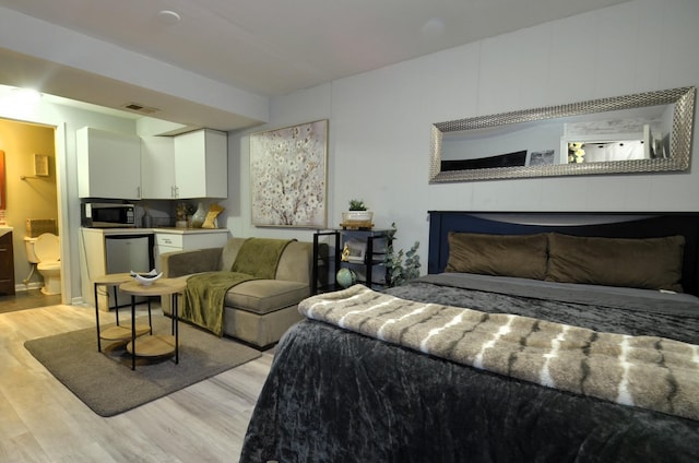 bedroom featuring visible vents and light wood finished floors