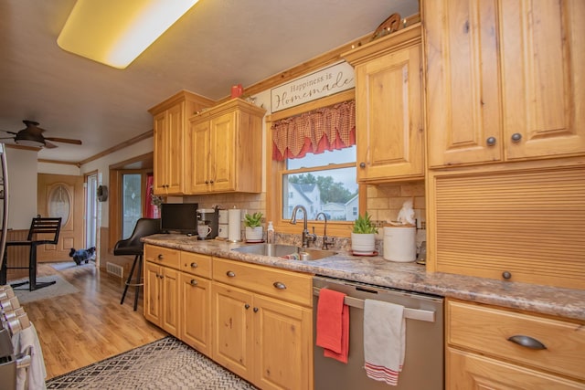 kitchen with ceiling fan, dishwasher, ornamental molding, decorative backsplash, and a sink