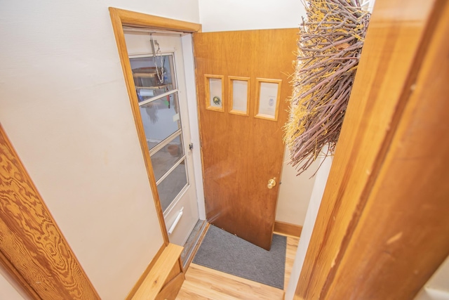 doorway to outside with wood finished floors