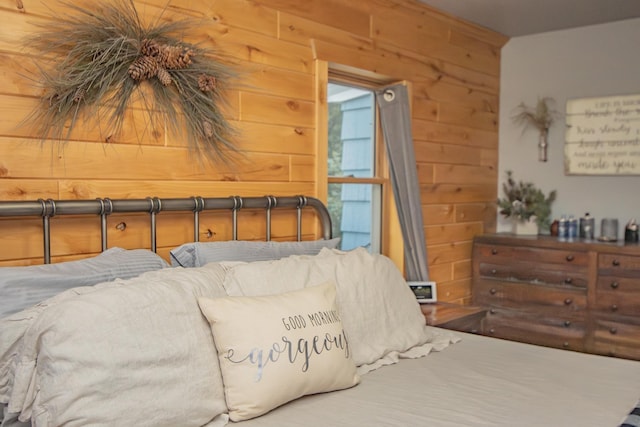 bedroom with wooden walls