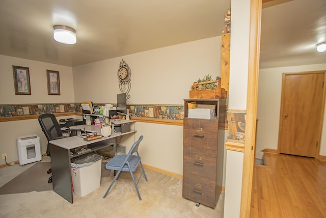 office with baseboards and wood finished floors