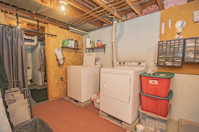 washroom with washer and dryer and laundry area