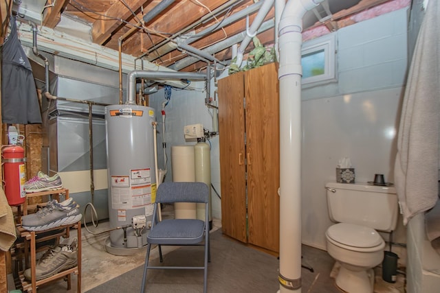 utility room featuring water heater