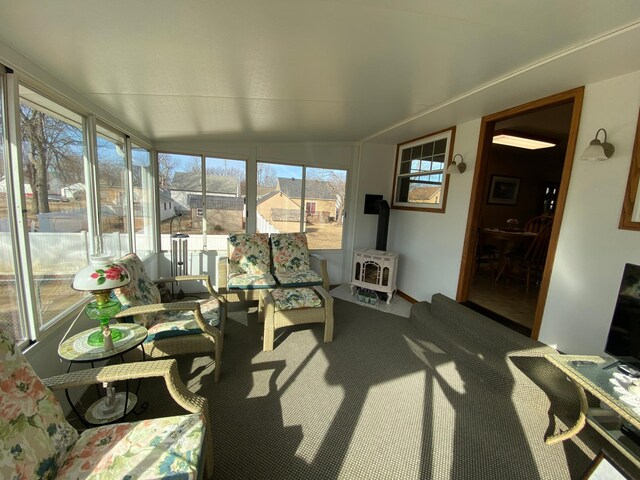 sunroom with a wood stove