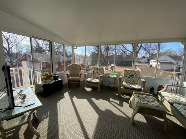 sunroom with lofted ceiling