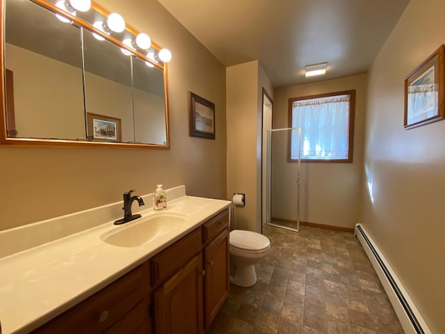 bathroom with toilet, a stall shower, stone finish floor, a baseboard heating unit, and vanity