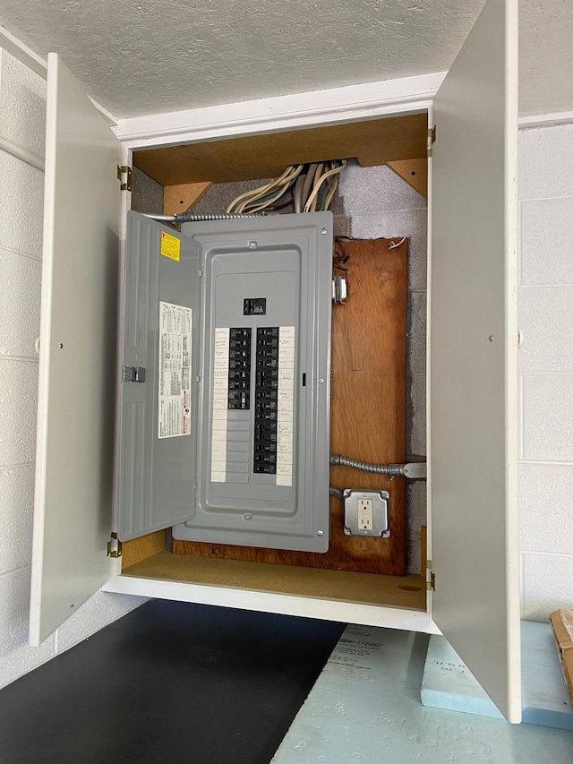 utility room featuring electric panel