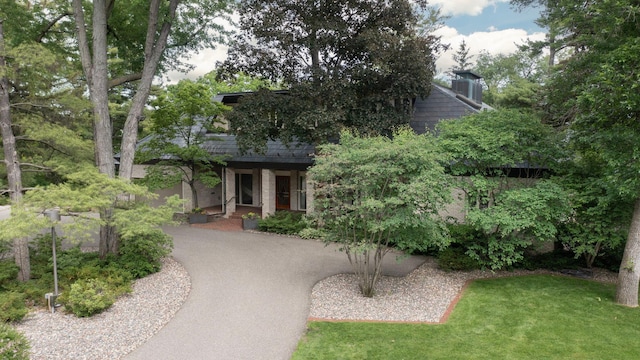 5123 Lake Ridge Rd, Edina, MN 55436 - view of front of property with brick siding and a front lawn