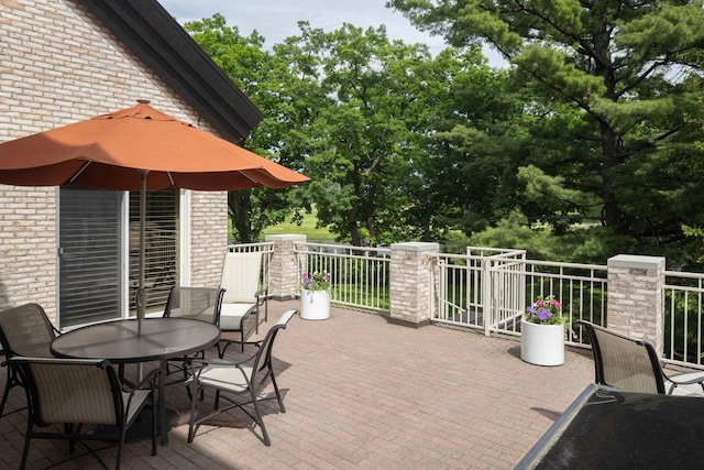 5123 Lake Ridge Rd, Edina, MN 55436 - view of patio with outdoor dining area and a balcony