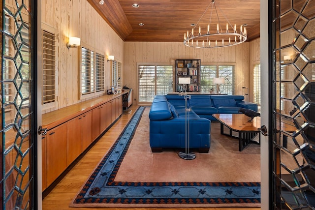 5123 Lake Ridge Rd, Edina, MN 55436 - living area with wood ceiling, a chandelier, recessed lighting, french doors, and wood walls