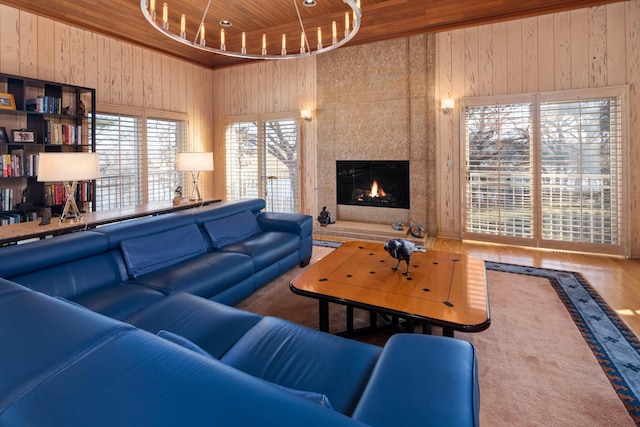5123 Lake Ridge Rd, Edina, MN 55436 - living area featuring wood ceiling, wooden walls, and a high end fireplace