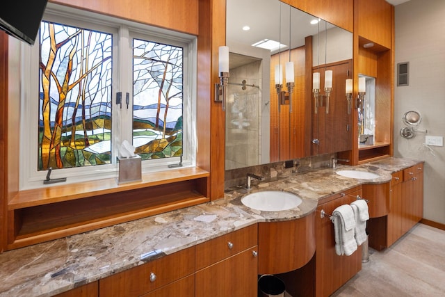 5123 Lake Ridge Rd, Edina, MN 55436 - full bathroom featuring double vanity, baseboards, and a shower