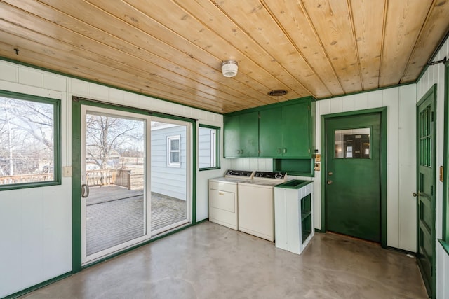 laundry area featuring cabinet space, separate washer and dryer, and wooden ceiling