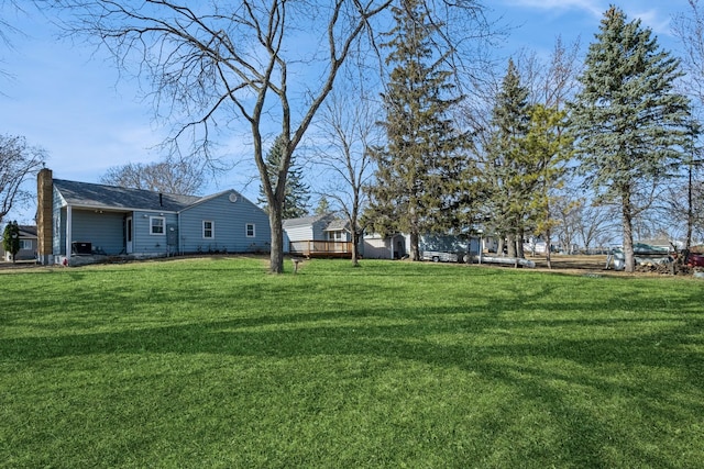 view of yard with a deck