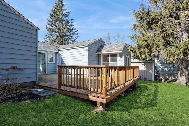 wooden terrace featuring a yard and fence