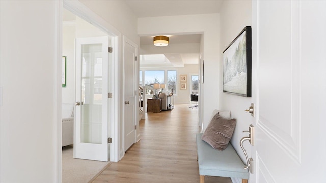 corridor featuring light wood-style floors