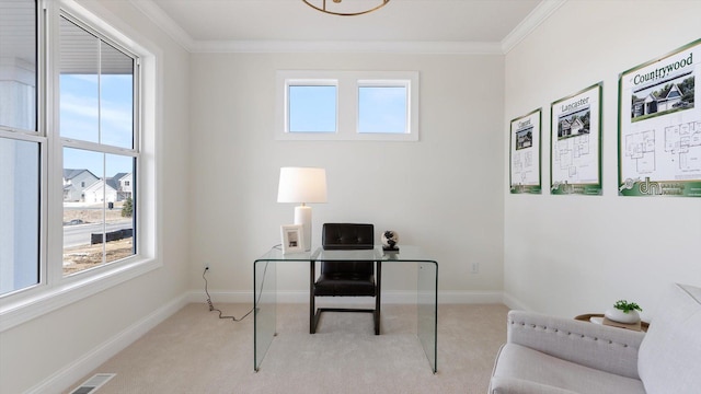 carpeted home office with visible vents, a healthy amount of sunlight, baseboards, and ornamental molding