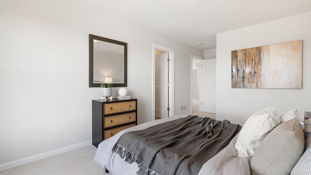 bedroom featuring visible vents, baseboards, and carpet flooring