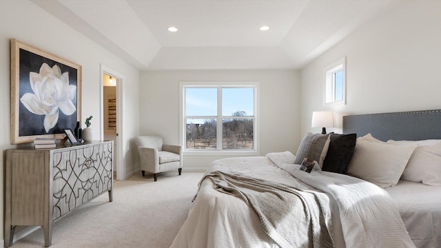 bedroom with light carpet, recessed lighting, a tray ceiling, and baseboards