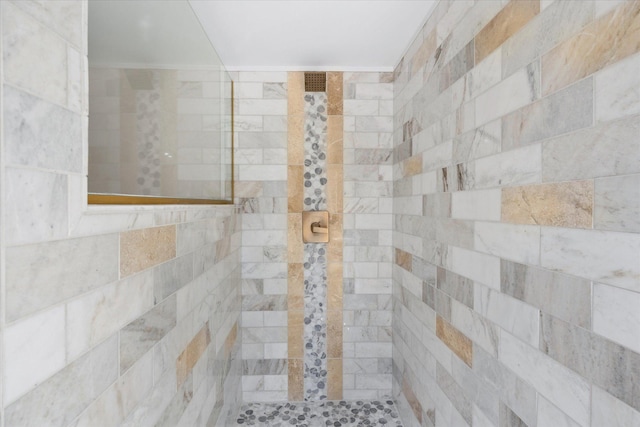 bathroom with tiled shower