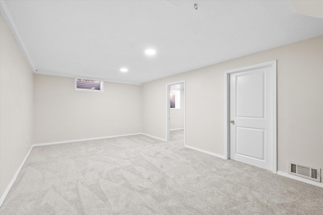 below grade area with recessed lighting, visible vents, baseboards, and carpet flooring