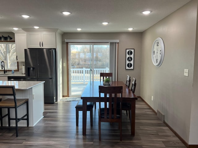 dining area with visible vents, recessed lighting, baseboards, and dark wood-style flooring