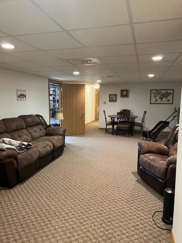 living room featuring carpet flooring, recessed lighting, and a drop ceiling