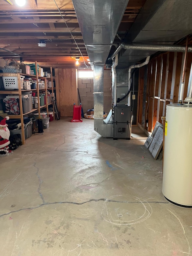 below grade area featuring gas water heater and heating unit