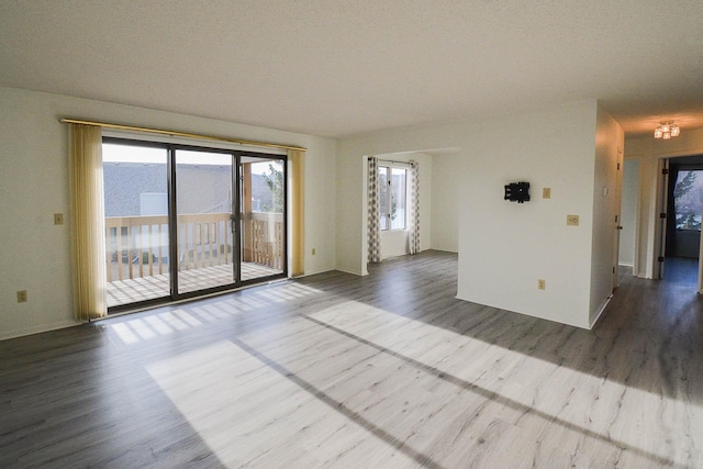 empty room with dark wood finished floors