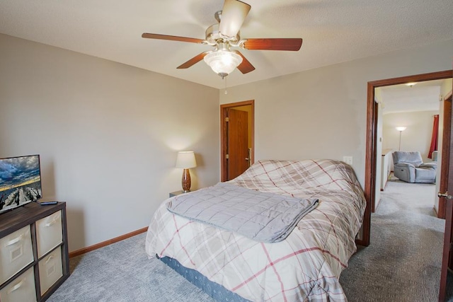 bedroom with baseboards, ceiling fan, and carpet flooring