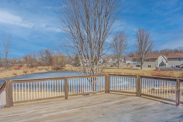 deck featuring a water view and a residential view