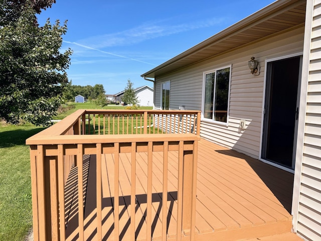 wooden terrace with a yard