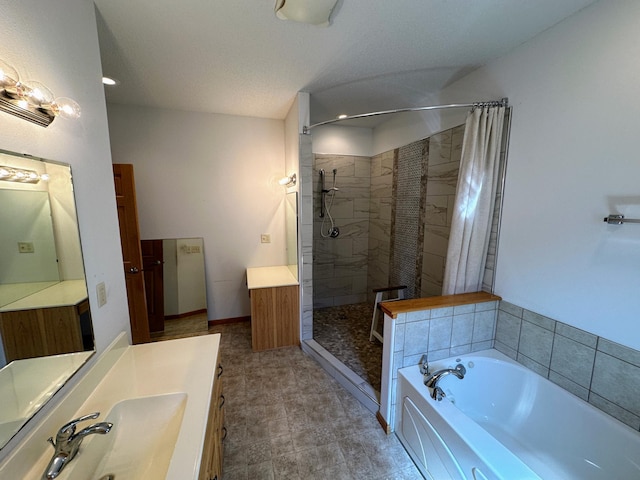 bathroom with baseboards, a garden tub, a stall shower, and vanity