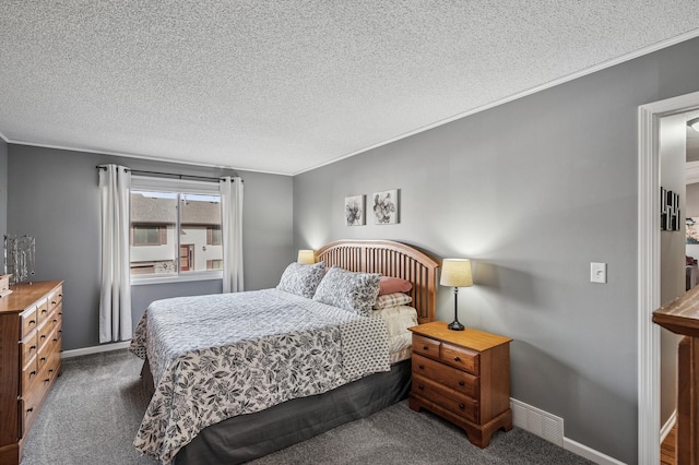 carpeted bedroom featuring a textured ceiling, visible vents, and ornamental molding