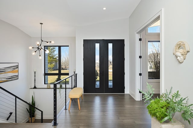 foyer entrance with a healthy amount of sunlight, french doors, and wood finished floors