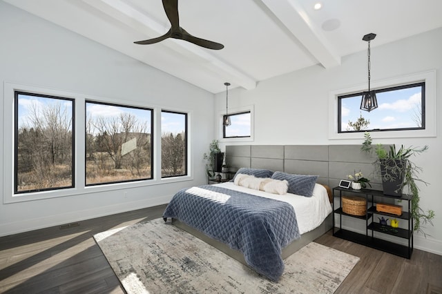 bedroom with lofted ceiling with beams, baseboards, multiple windows, and dark wood-style flooring