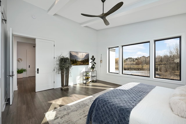 bedroom with a ceiling fan, beamed ceiling, baseboards, and dark wood-style flooring