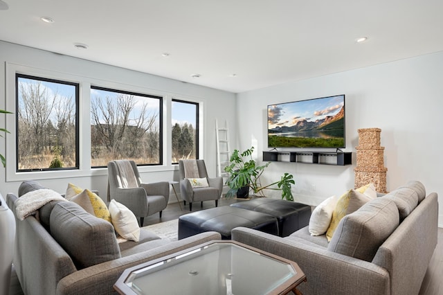 living room with recessed lighting, wood finished floors, and baseboards