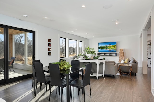 dining area with recessed lighting and light wood-type flooring