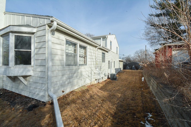 view of side of home featuring central air condition unit