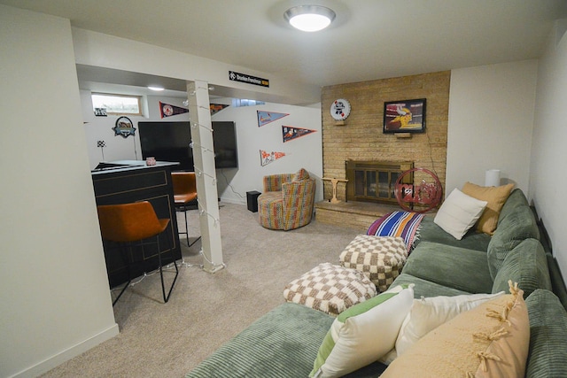 carpeted living area featuring baseboards and a brick fireplace