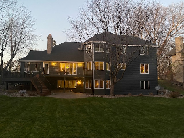 back of house with a deck, stairway, a yard, and a patio area