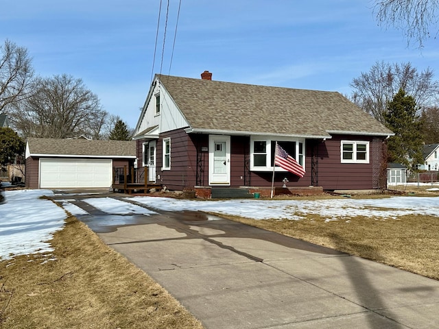 view of front of house with a garage, roof with shingles, and a chimney