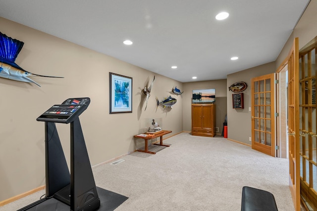 exercise area featuring recessed lighting, baseboards, and carpet flooring