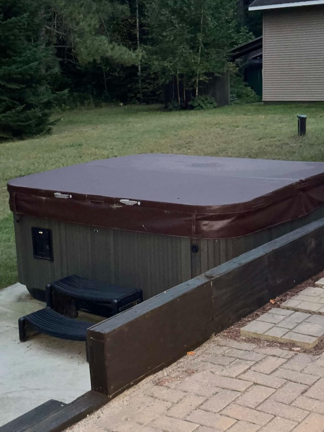 exterior space featuring a covered hot tub