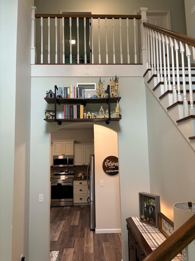 stairway with wood finished floors