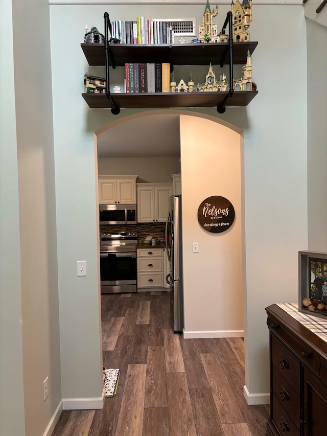 interior space featuring dark wood-style floors and baseboards