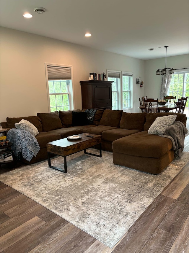 living area with dark wood finished floors, recessed lighting, and visible vents